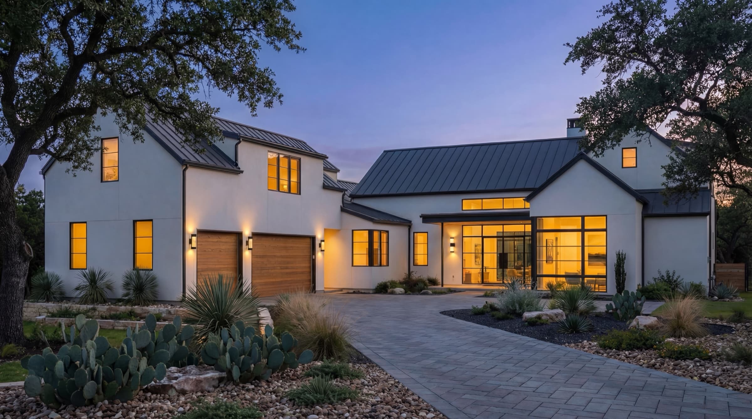 Spanish Oaks front exterior at twilight